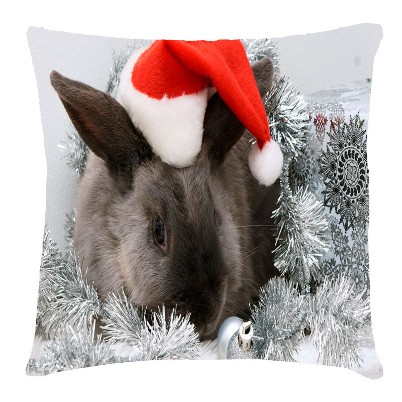 Подушка с принтом 'Кролик в новогодней мишуре'